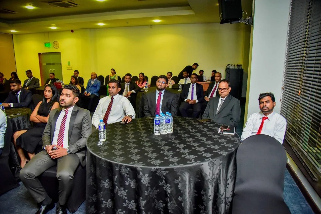 Infomate corporate team members attending a professional business conference and presentation in Colombo.